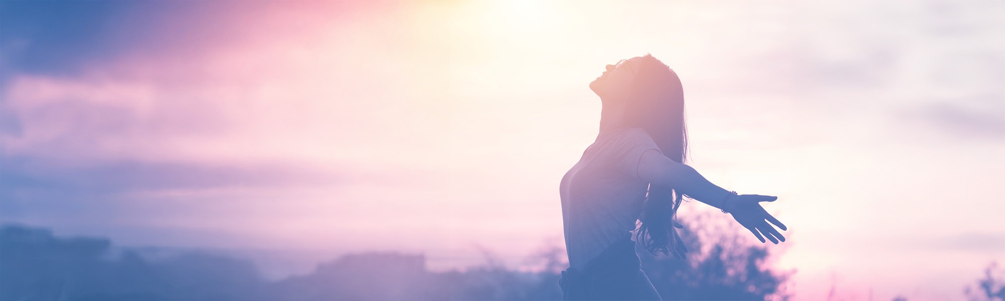 Young woman relaxing in summer sunset sky outdoor